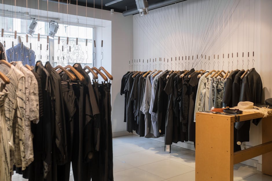 Modern clothing store showcasing a variety of garments on hangers.